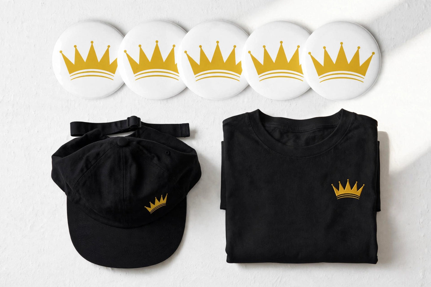 KASH CROWN pin button set — detail photo of the black and gold crown pins